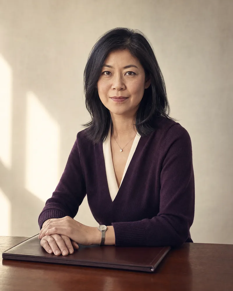 Editorial portrait of Margaret Chen at her desk
